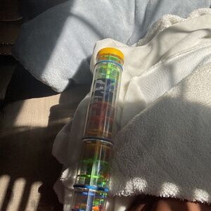 A stick with colorful balls in it